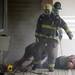 Ann Arbor firefighters pull "victims" from a simulated fire during a training exercise at Parkhurst Apartments on Wednesday. Melanie Maxwell I AnnArbor.com 